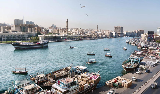 See the old fishing boats at Bur Dubai Abra Dock